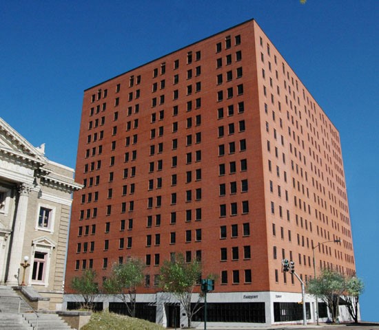 Fairmont Apartments Red Exterior Next to other buildings